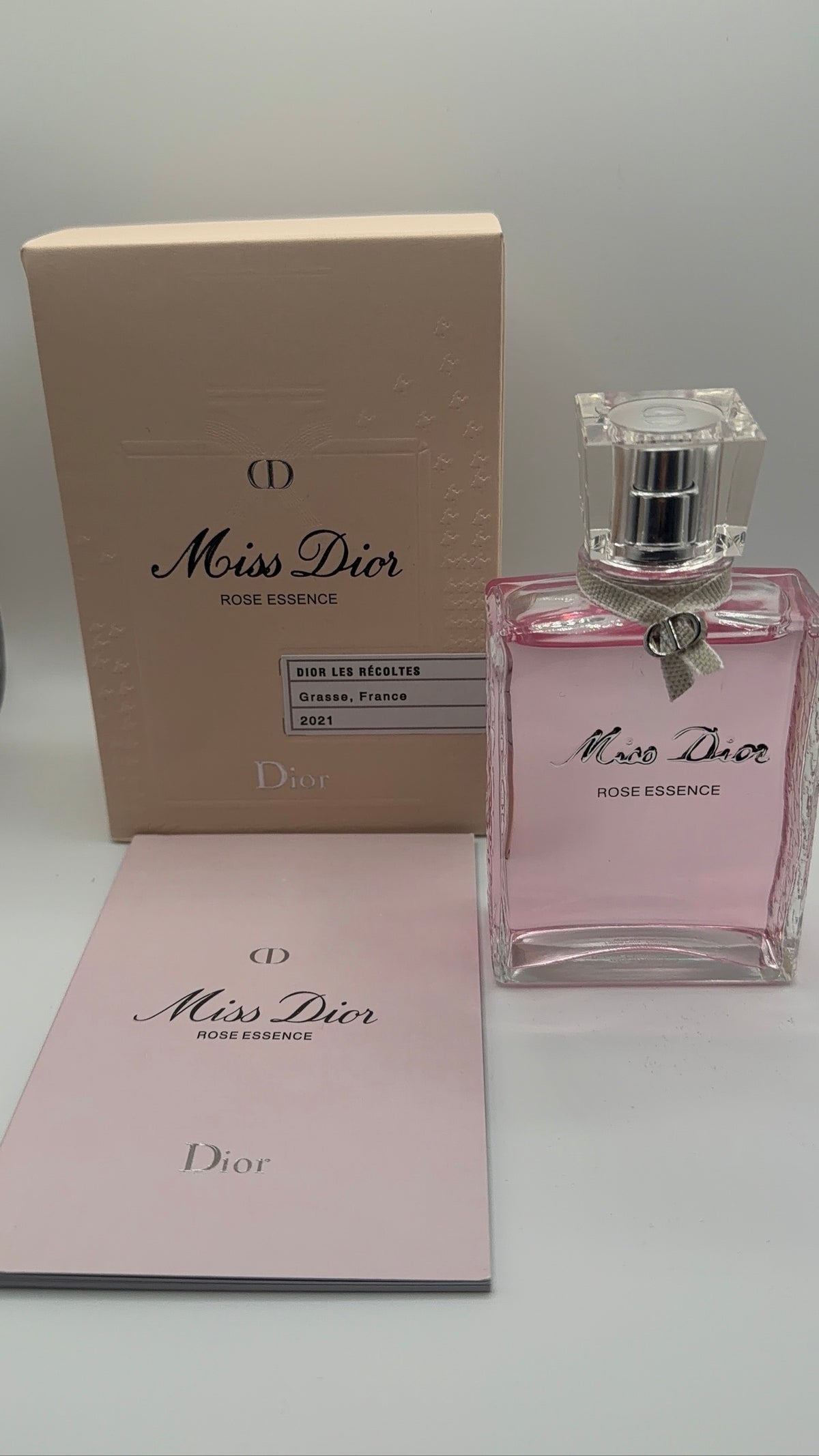 Miss Dior Rose Essence bottle, box and booklet - front view